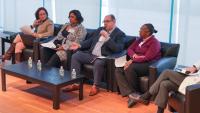 A panel discussion on a stage